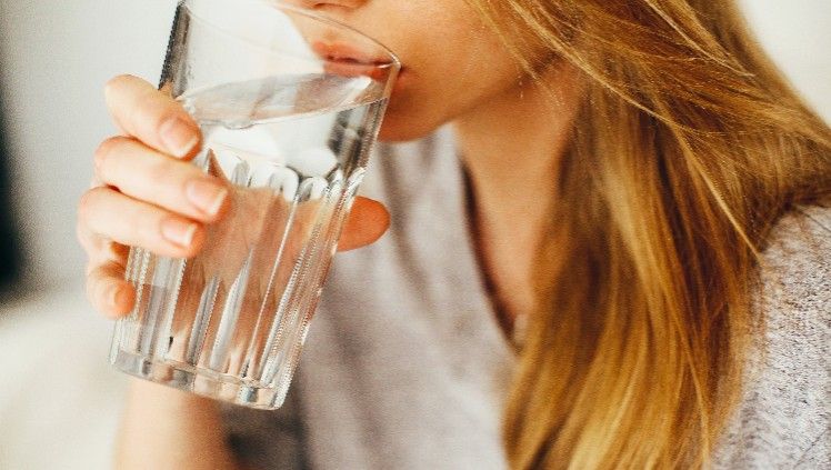 woman drinking water tcm article